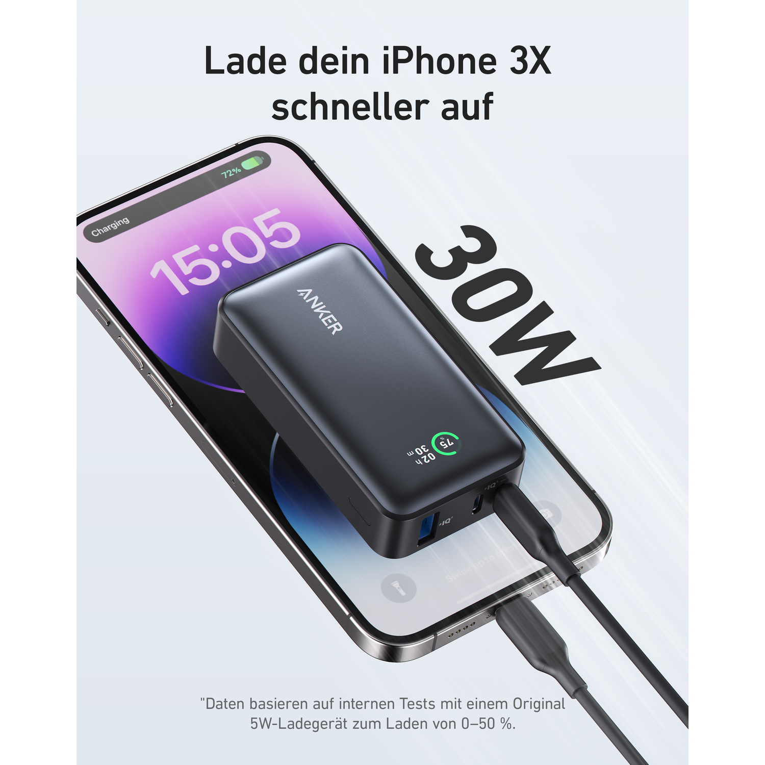Black power bank charging a phone. The screen shows the phone is charging.