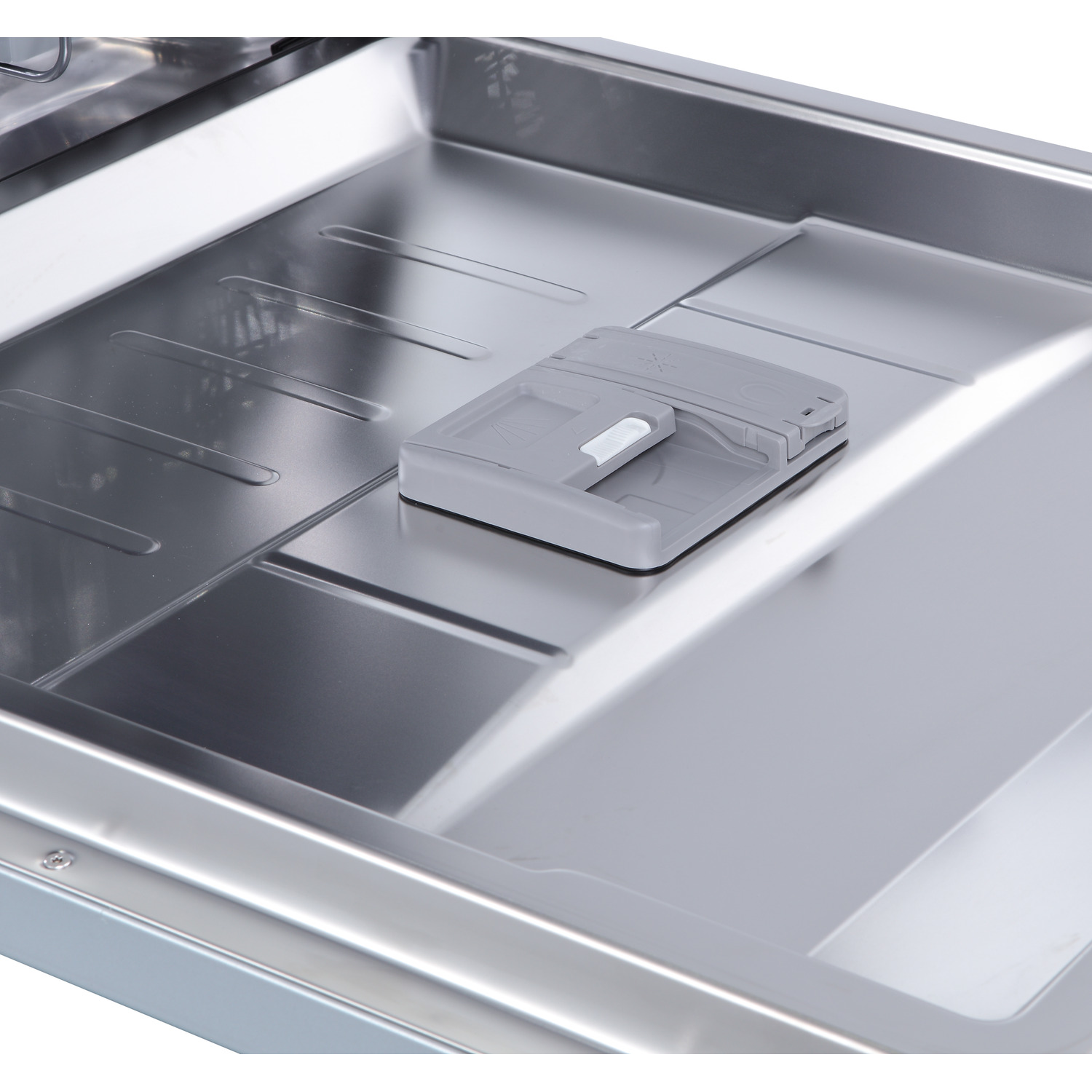 Inside view of a dishwasher with a grey detergent dispenser.