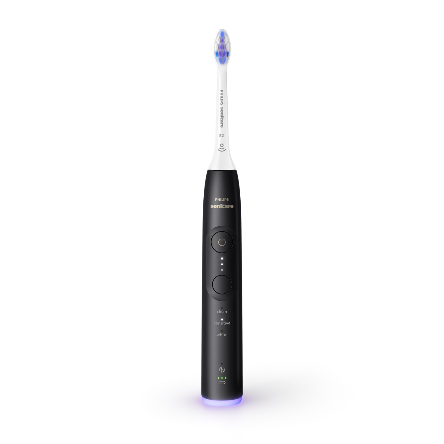 Une brosse à dents électrique noire. Boutons et lumières sur le manche. Fond blanc.