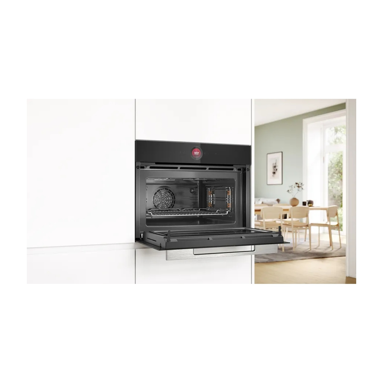 Forno nero ad incasso, porta aperta. Interno in acciaio inox, ambiente scuro.