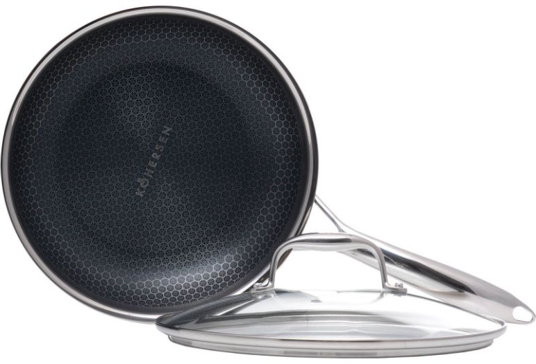 Patelnia nieprzywierająca z podstawą o wzorze plastra miodu, pokrywką i uchwytem ze stali nierdzewnej.