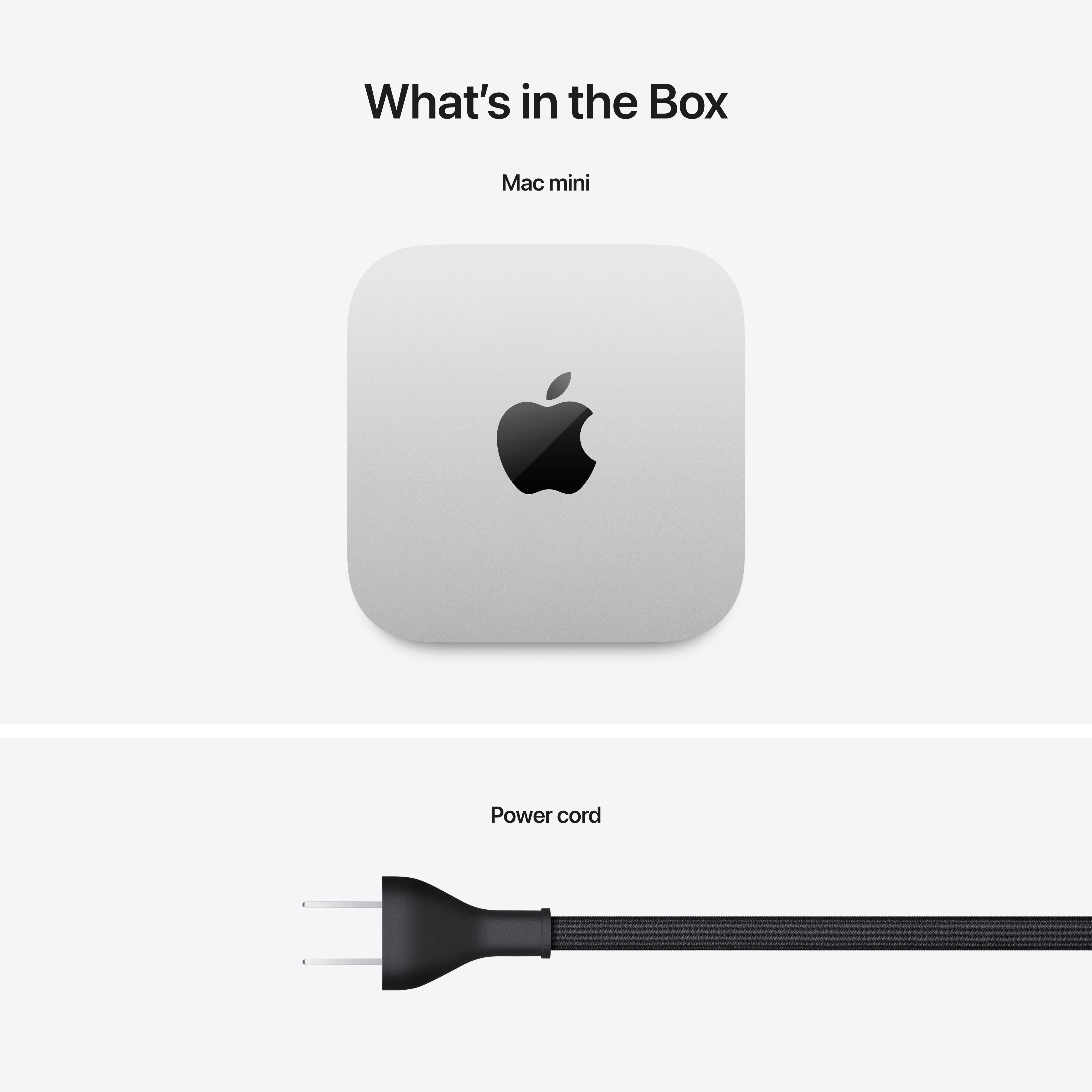 Mac Mini bianco e un cavo di alimentazione nero. Il logo Apple è visibile. Sfondo bianco.