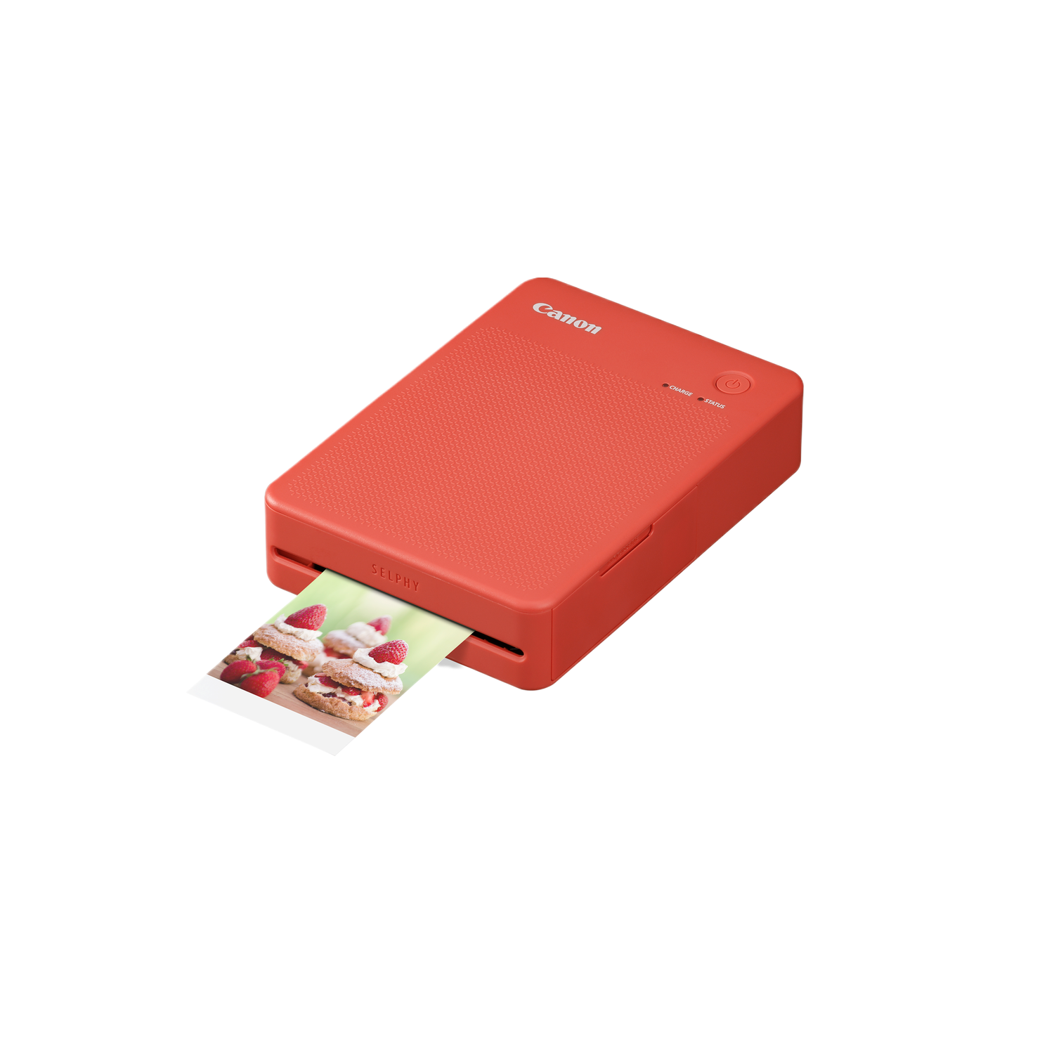 Rode draagbare printer die een foto afdrukt van gebak met aardbeien.