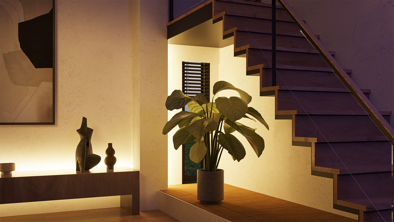 Vista interior con escaleras, planta y obras de arte. Iluminación cálida. Diseño de hogar moderno.