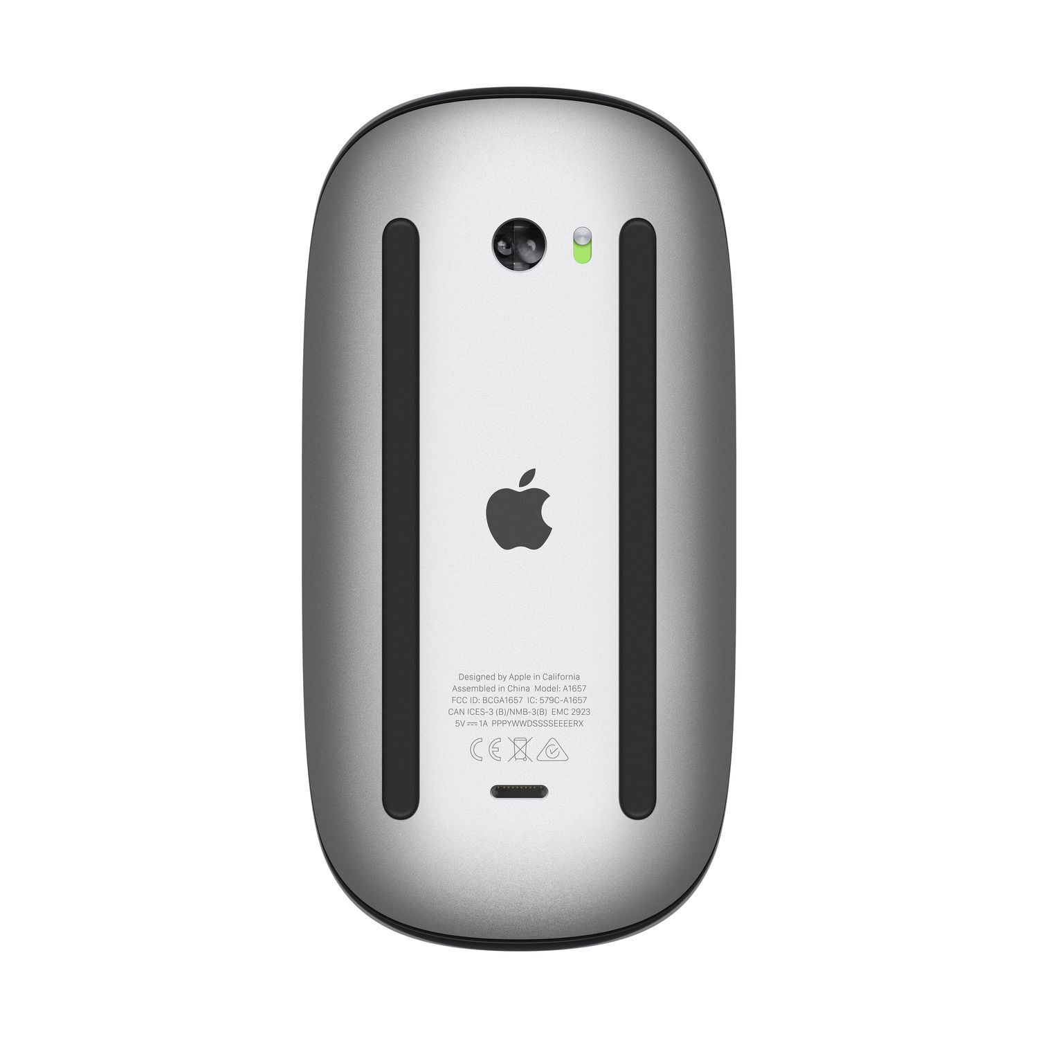 Silver Apple Magic Mouse, viewed from the bottom. Shows the Apple logo, charging port, and device details.