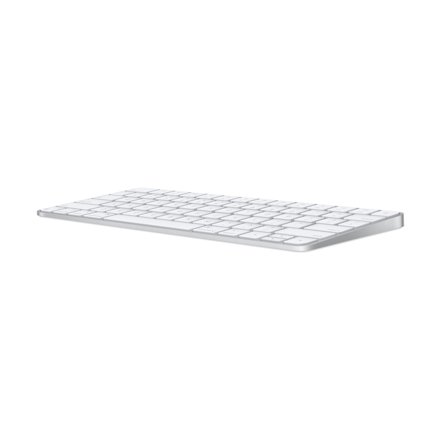 Silver Apple Magic Keyboard. The keyboard has white keys with a silver frame, laid on a white surface.