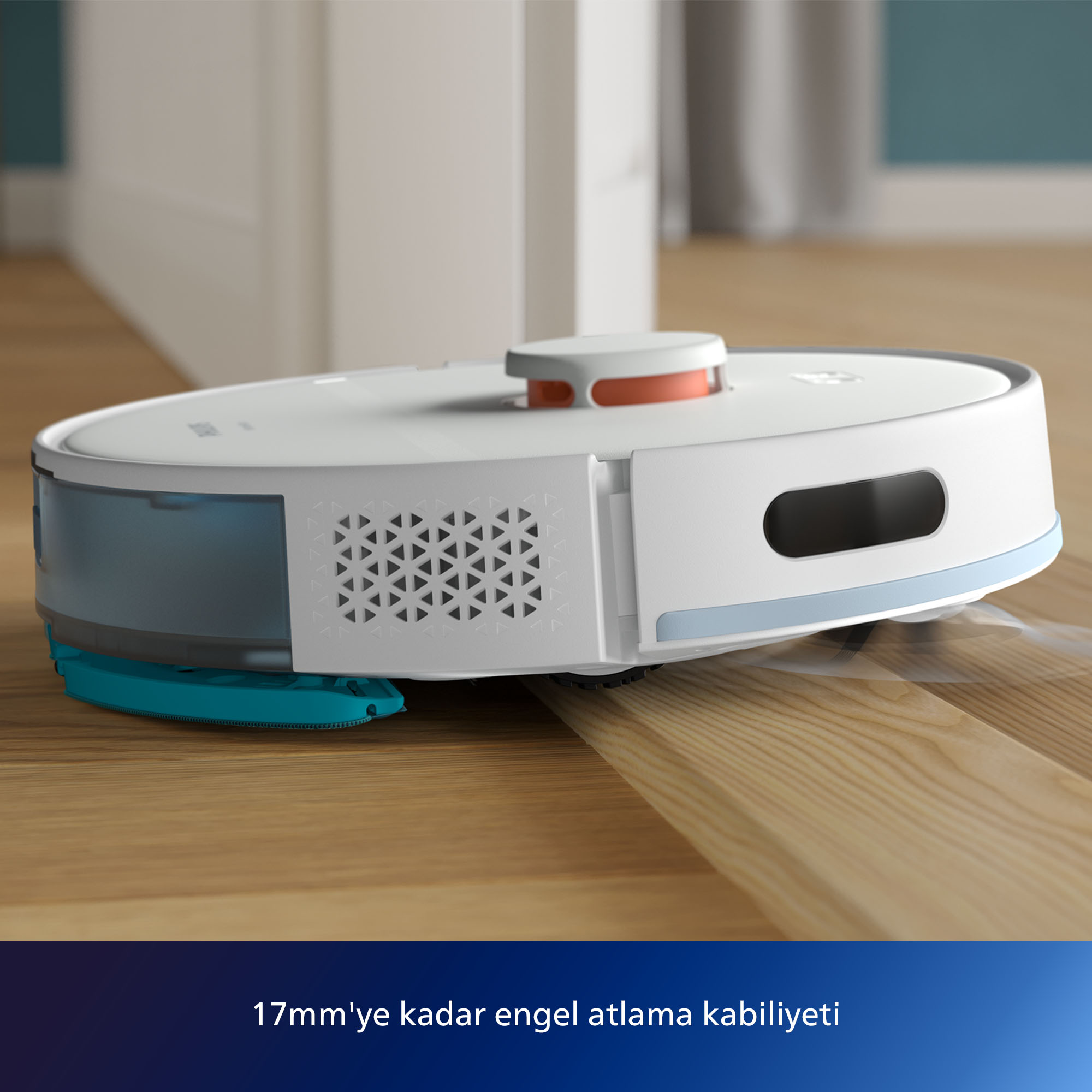 Beyaz bir robot süpürge, ahşap bir zeminde hareket ediyor, engelleri aşma yeteneğini vurguluyor.