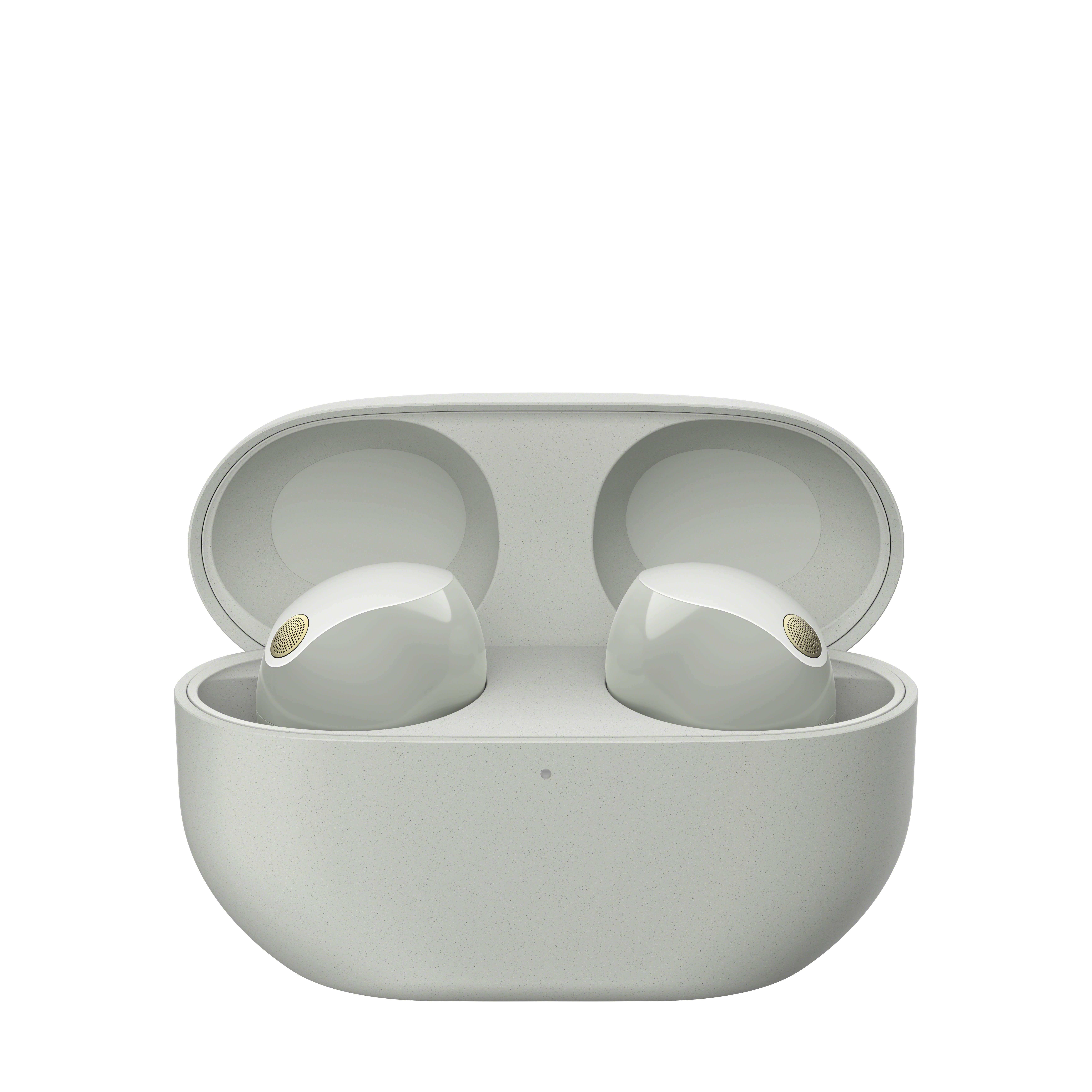 Un par de auriculares inalámbricos blancos dentro de su estuche de carga abierto.