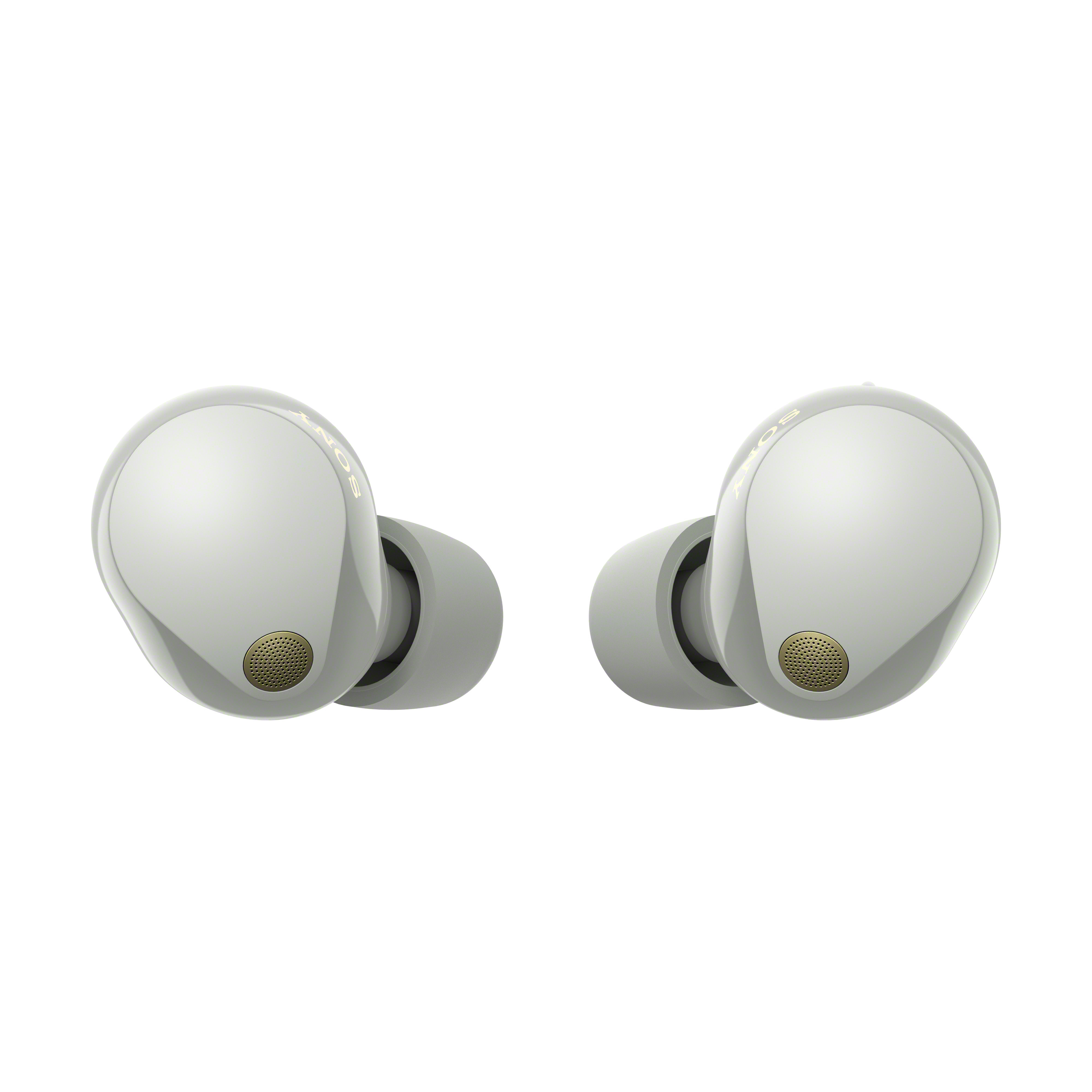 Dos auriculares Sony grises con detalles dorados, sobre un fondo blanco.