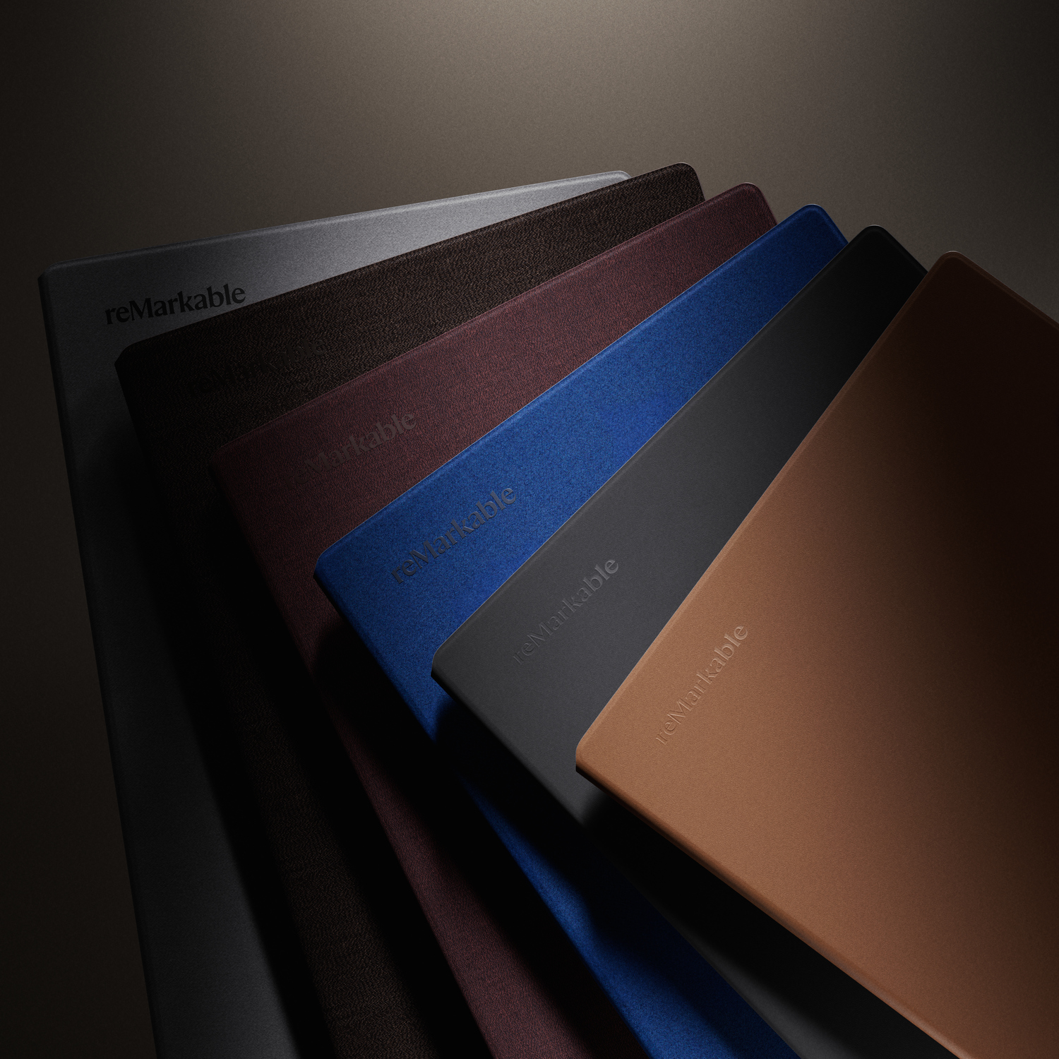 Collection of reMarkable tablets in various colors, angled and stacked.