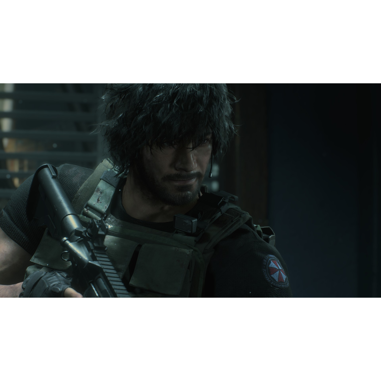 A man in a tactical vest holds a rifle. He looks serious. The background is dim.