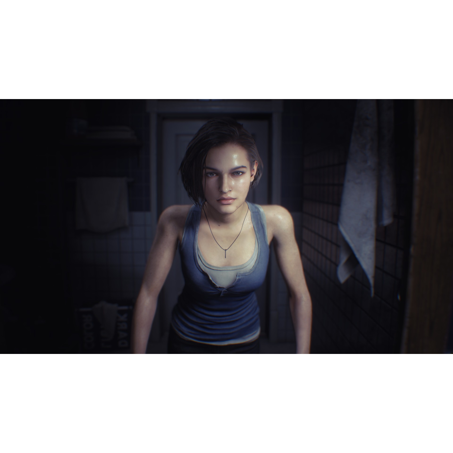 A woman from a video game, standing in a dark, tiled room. She wears a blue top and has a necklace.