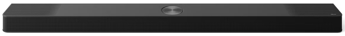 Czarny soundbar LG na białym tle. Długi, prostokątny kształt z centralnym srebrnym okręgiem.