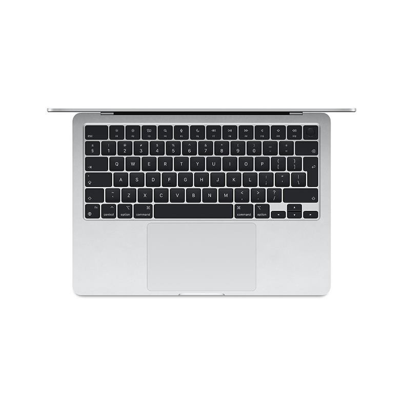 Felülnézet egy ezüst laptop billentyűzetéről, a billentyűket és a szóköz billentyűt mutatva.
