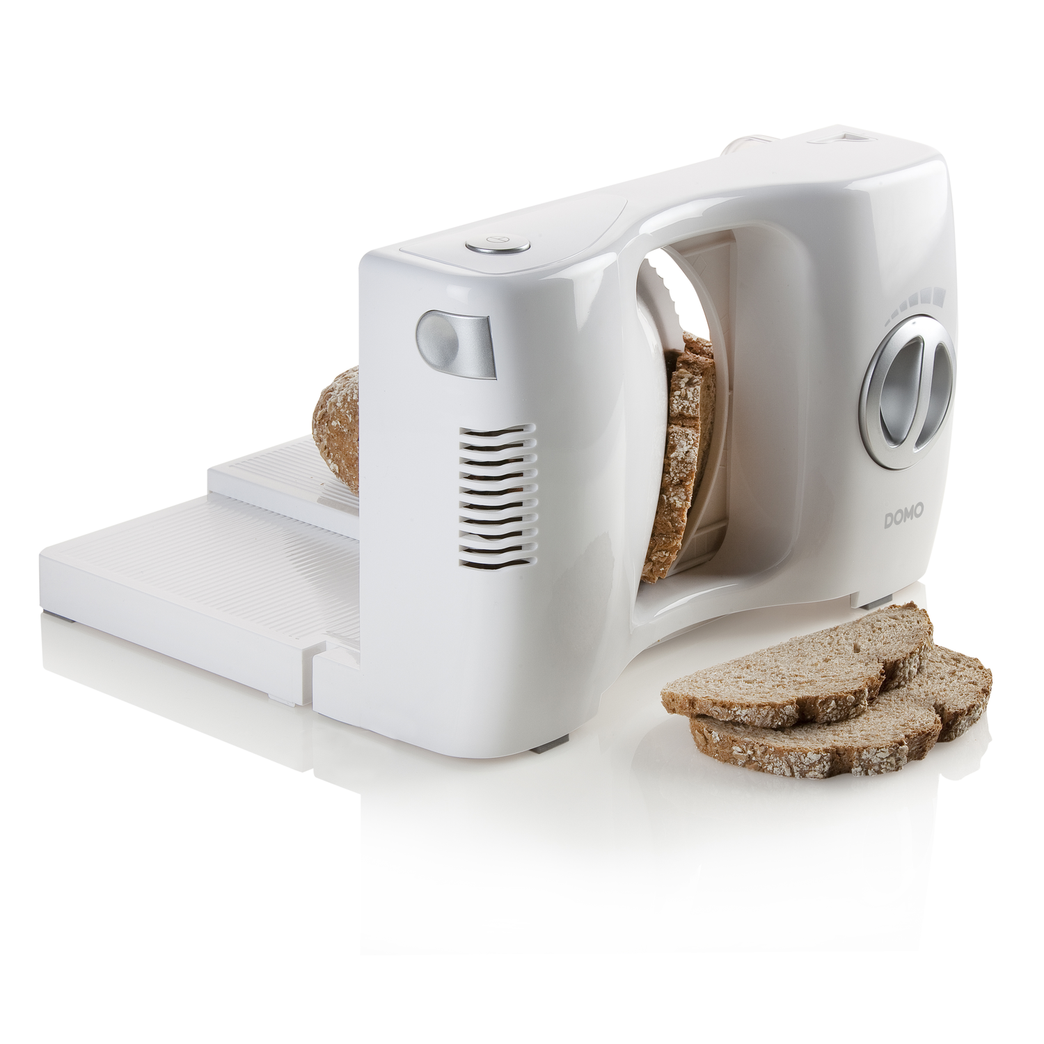A white bread slicer with a loaf and sliced bread. The slicer is on a white surface. The brand DOMO is visible.