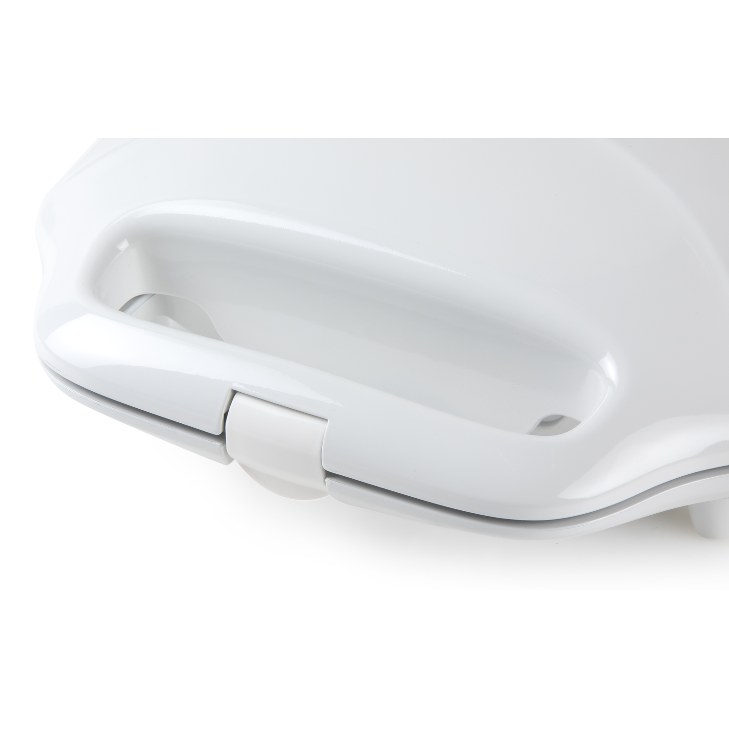 Close-up of a white appliance handle with a white button lock.