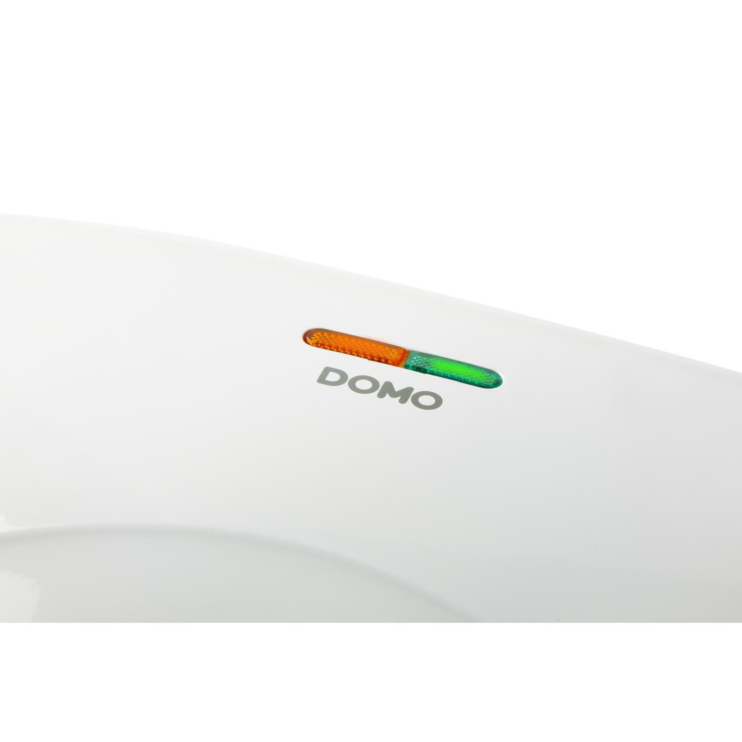 Close up of a white appliance with an orange and green indicator.