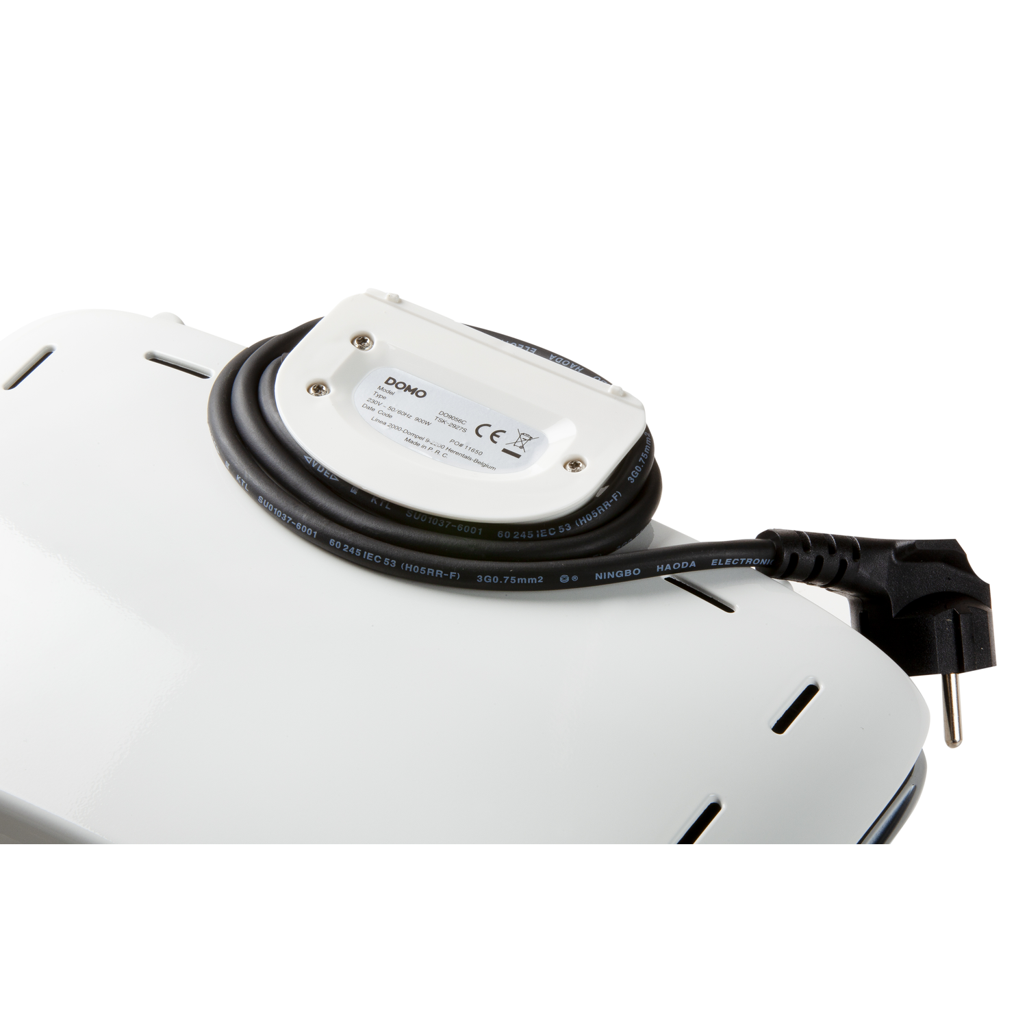 Underside of a white appliance with a black power cord and plug.