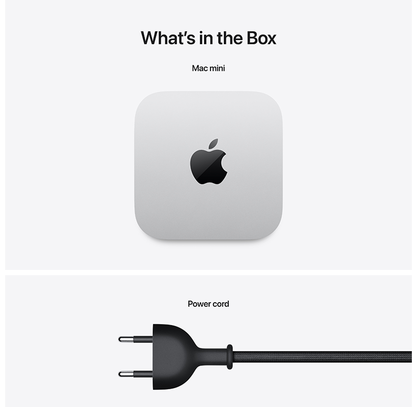 Egy Mac mini és egy tápkábel fehér háttéren. A csomagolás látható.