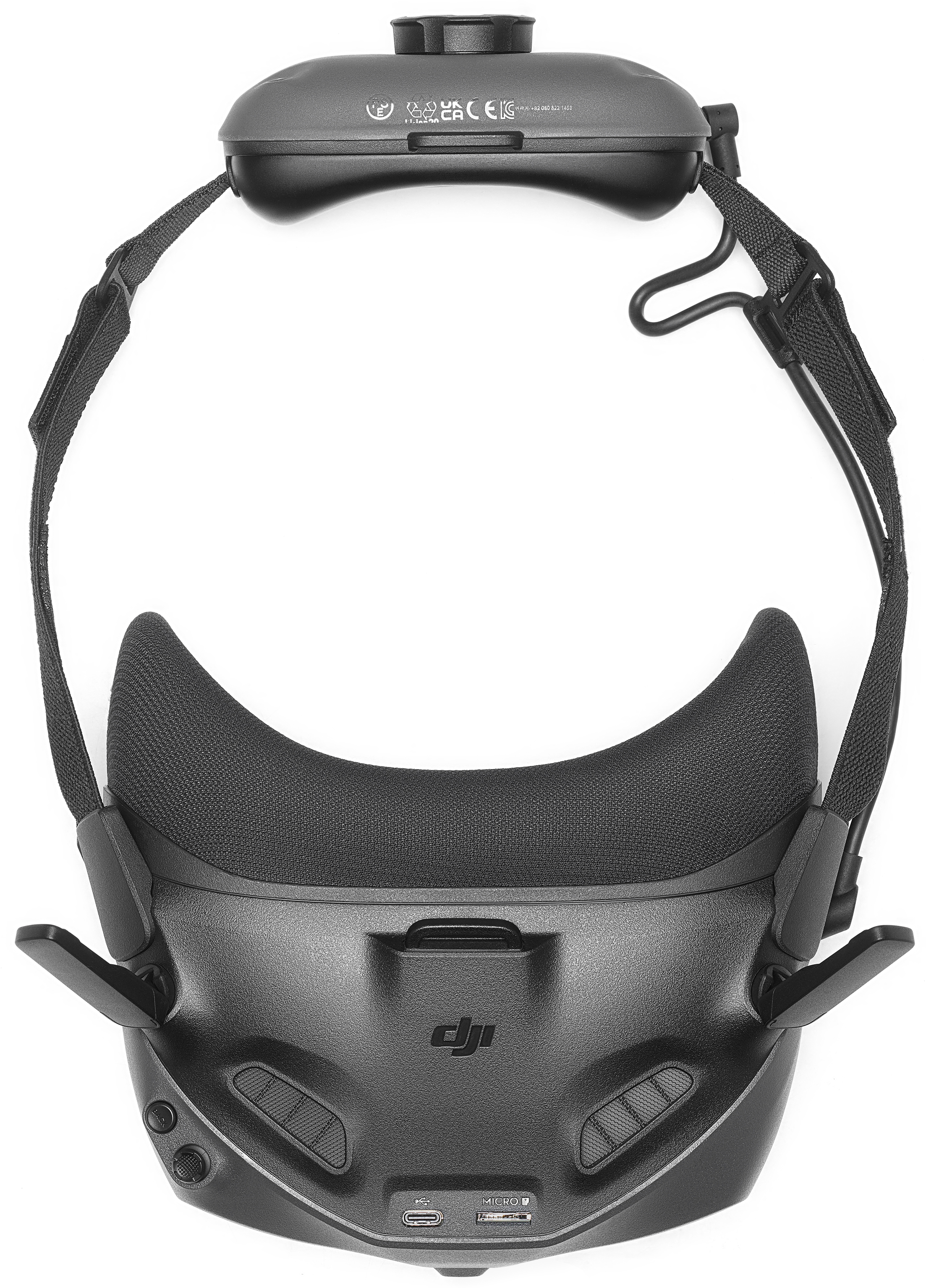 Casque VR noir avec bandeau. Le dessus a un coussinet noir. Le bas montre des boutons et un port.