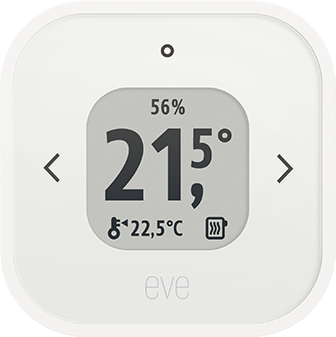 Egy fehér okos termosztát mutatja a hőmérsékletet és a páratartalmat. Nyilak és digitális kijelző van rajta.