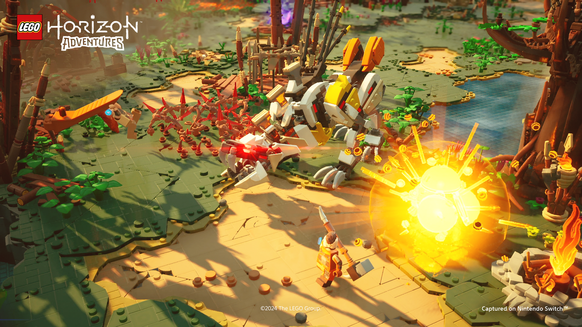 Lego-Szene mit Roboter, Figur und Explosion. Der Hintergrund ist ein Wald mit Bäumen.