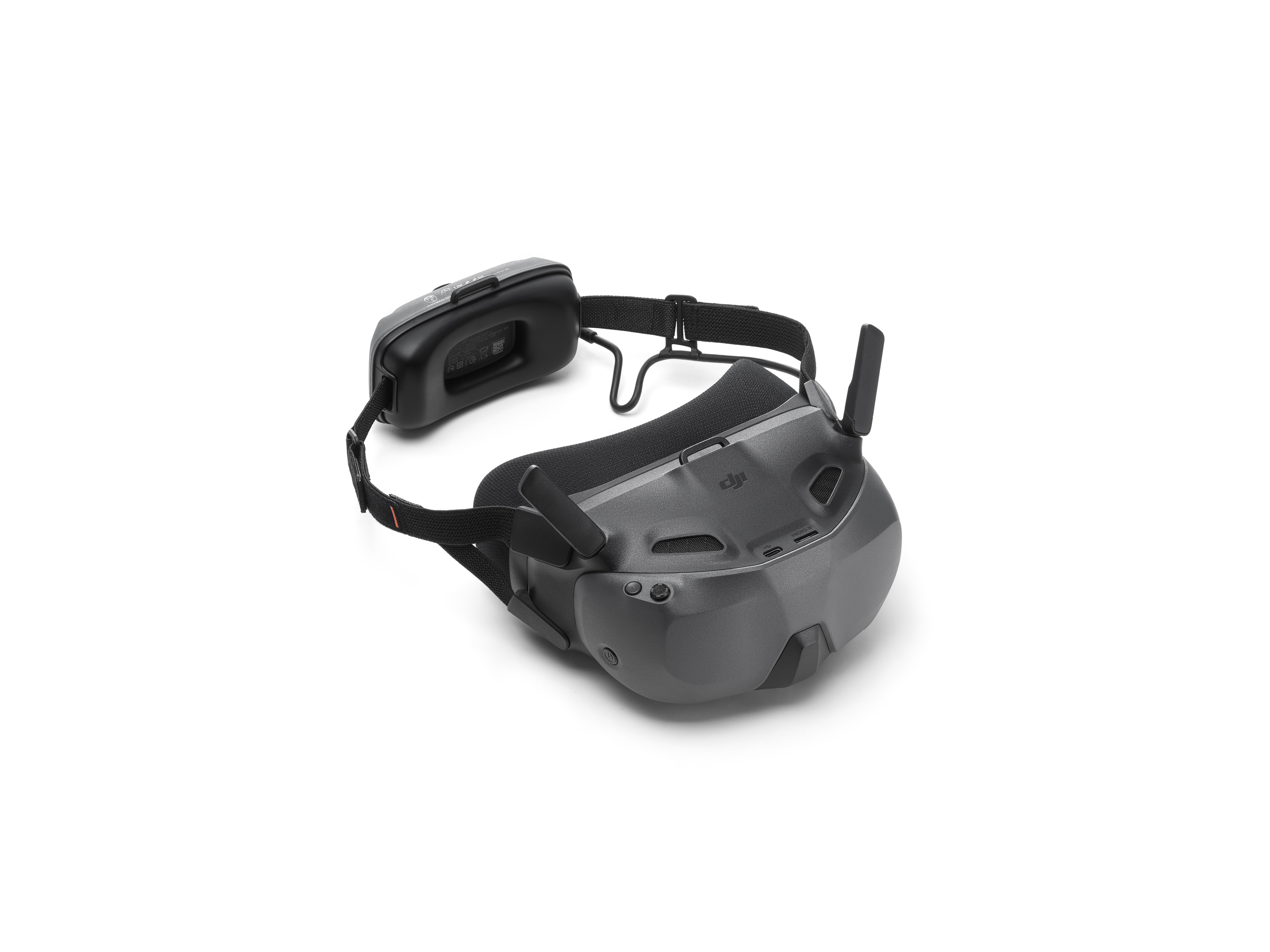 Ein schwarzes VR-Headset mit Kopfband, Antennen und Akkupack auf weißem Hintergrund.