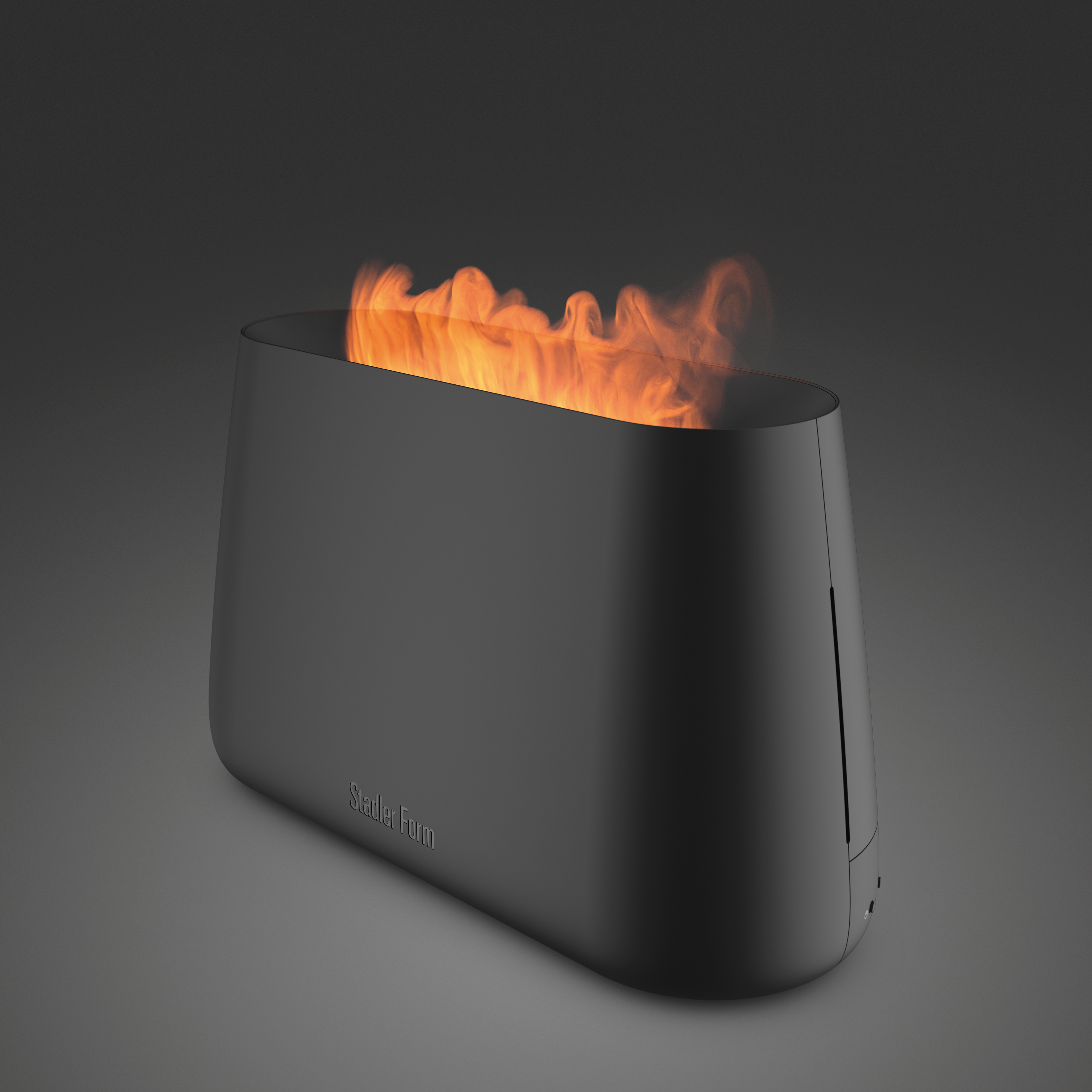 Schwarzer, minimalistischer Feuerkorb. Flammen sind sichtbar. 'Stadler Form' steht drauf.