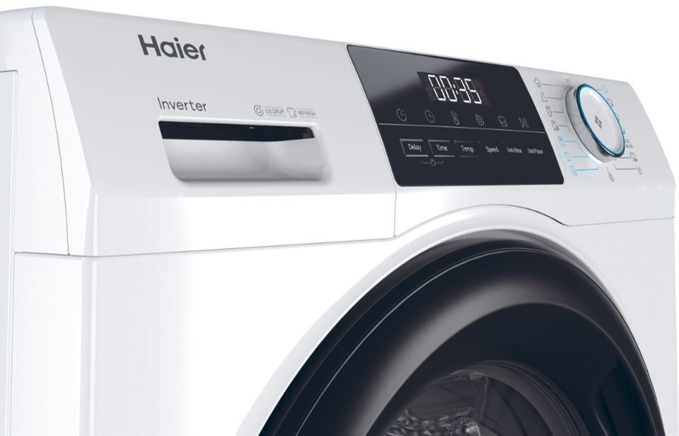 White washing machine front view. There is a display and control buttons. The door is black.