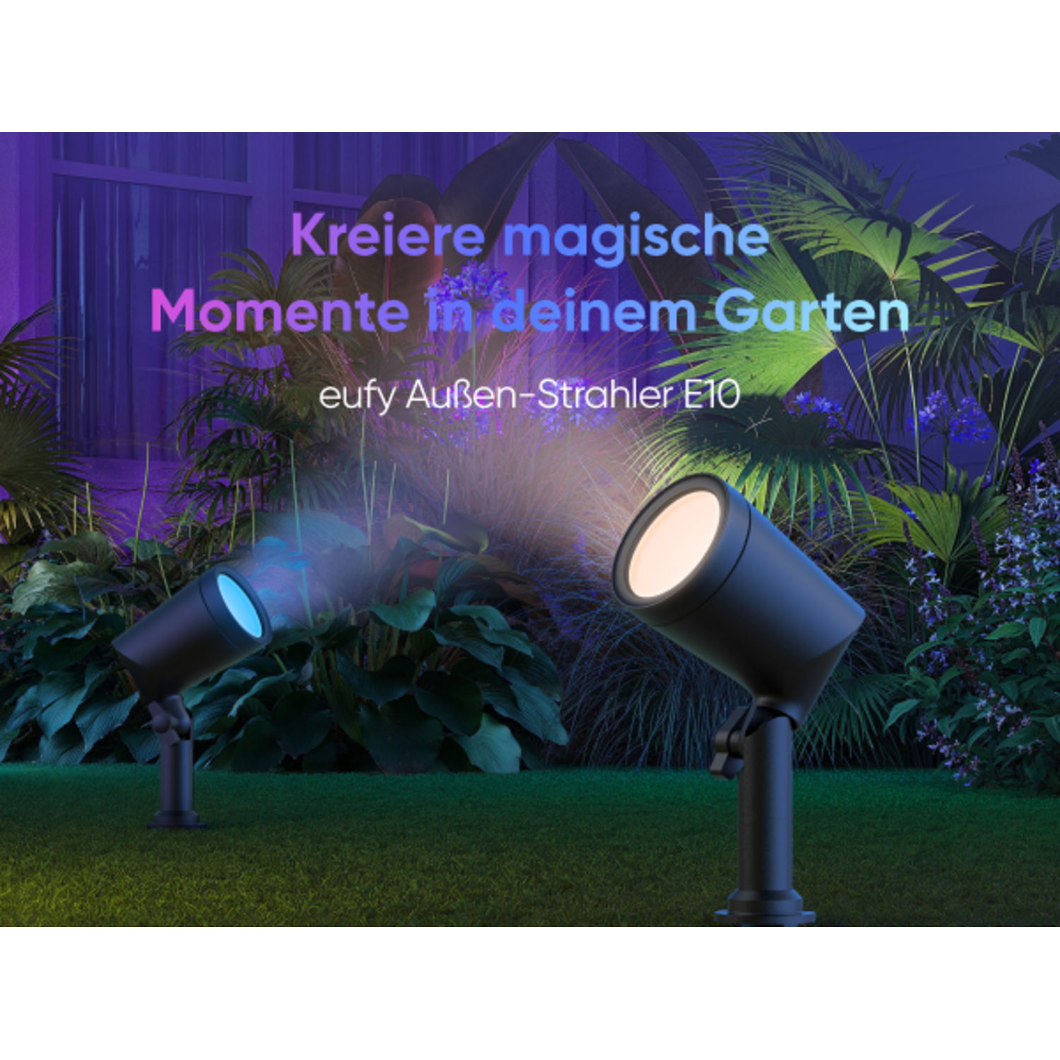 Two black spotlights illuminate a green lawn at night.