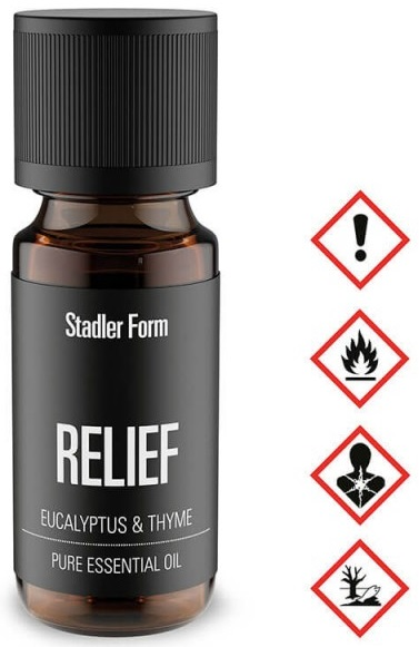 Czarna butelka olejku eterycznego z napisem 'RELIEF' i symbolami zagrożenia.