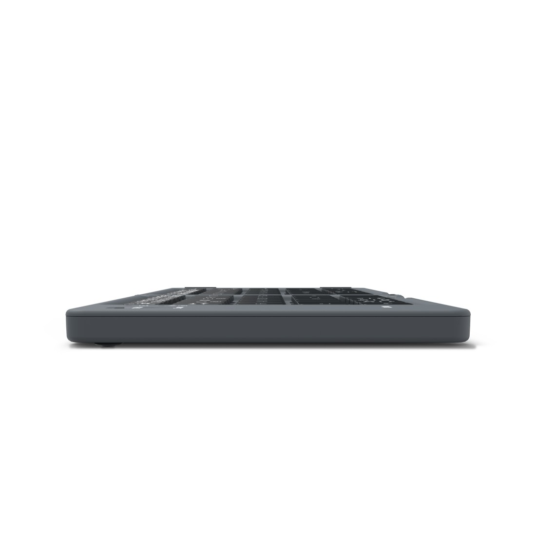Eine graue Tastatur mit flachem Design, von der Seite vor weißem Hintergrund gesehen.