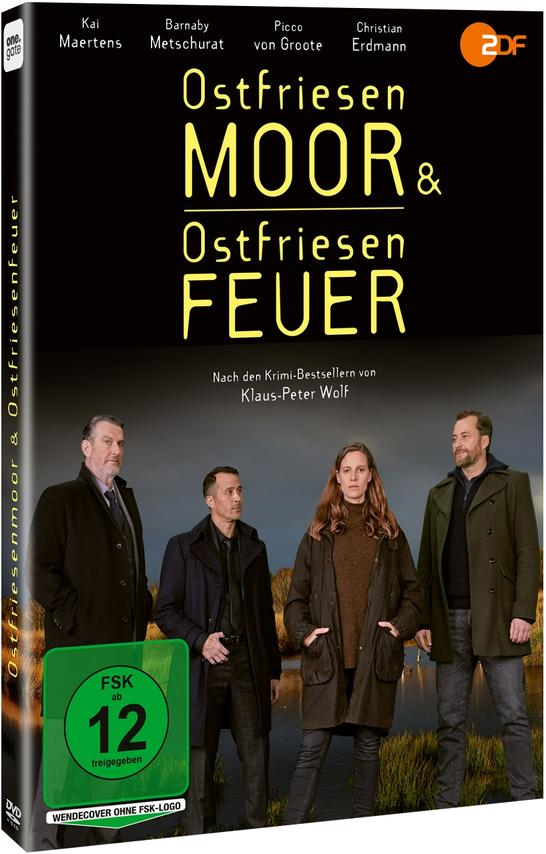 DVD-Cover mit vier Personen, die vor einem dunklen Hintergrund stehen.