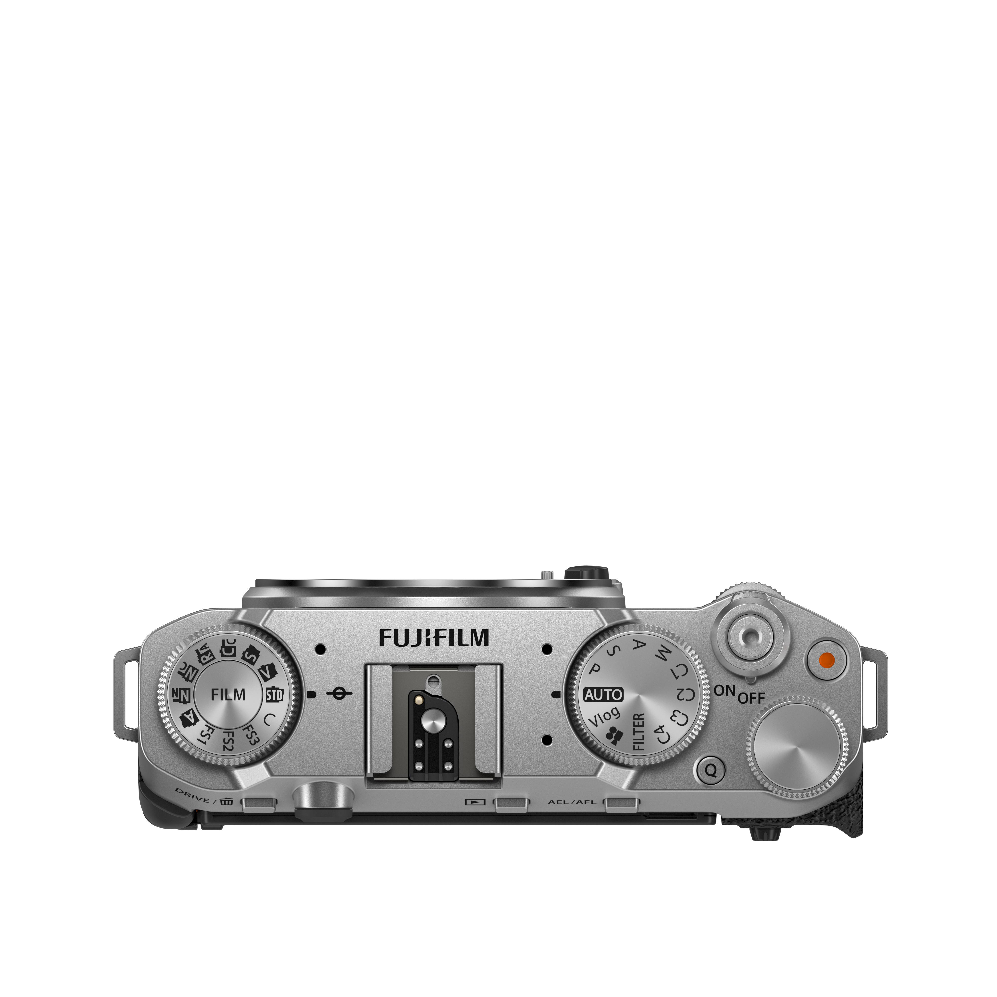 Eine silberne Fujifilm-Kamera, Draufsicht, mit verschiedenen Einstellrädern und Knöpfen.