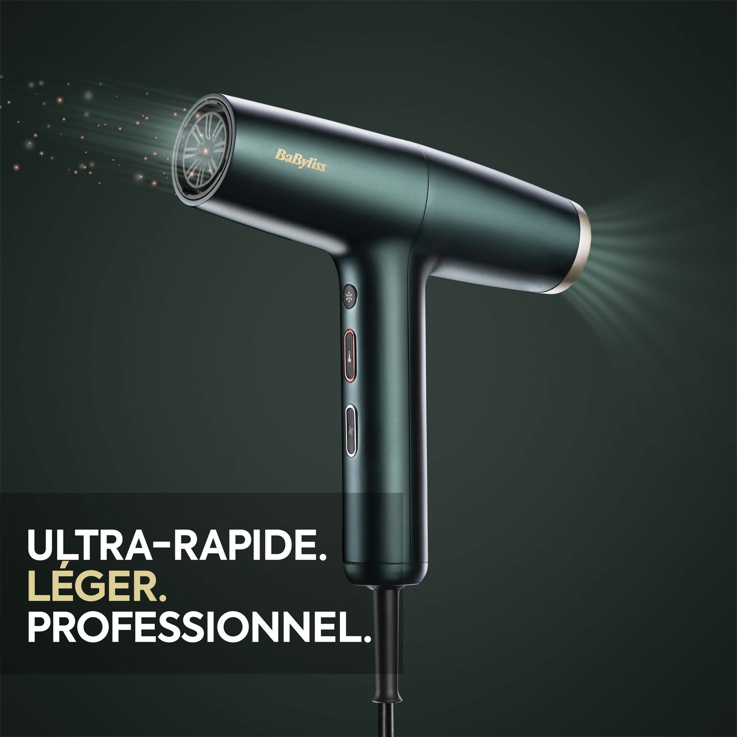 Sèche-cheveux vert. Il a une poignée, des boutons et une buse, avec la marque 'BaByliss'.