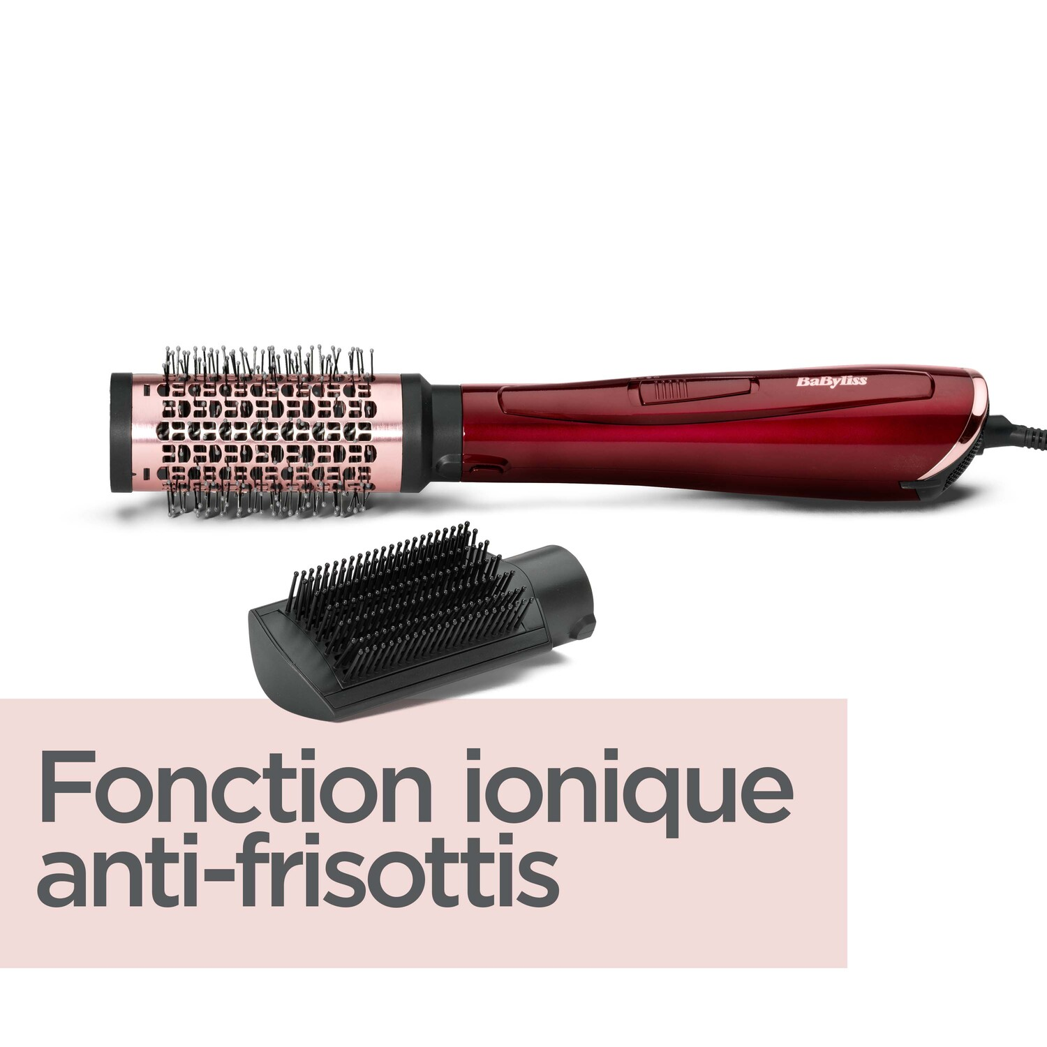 Fer à boucler rouge et noir avec brosse attachée et une tête de brosse séparée.