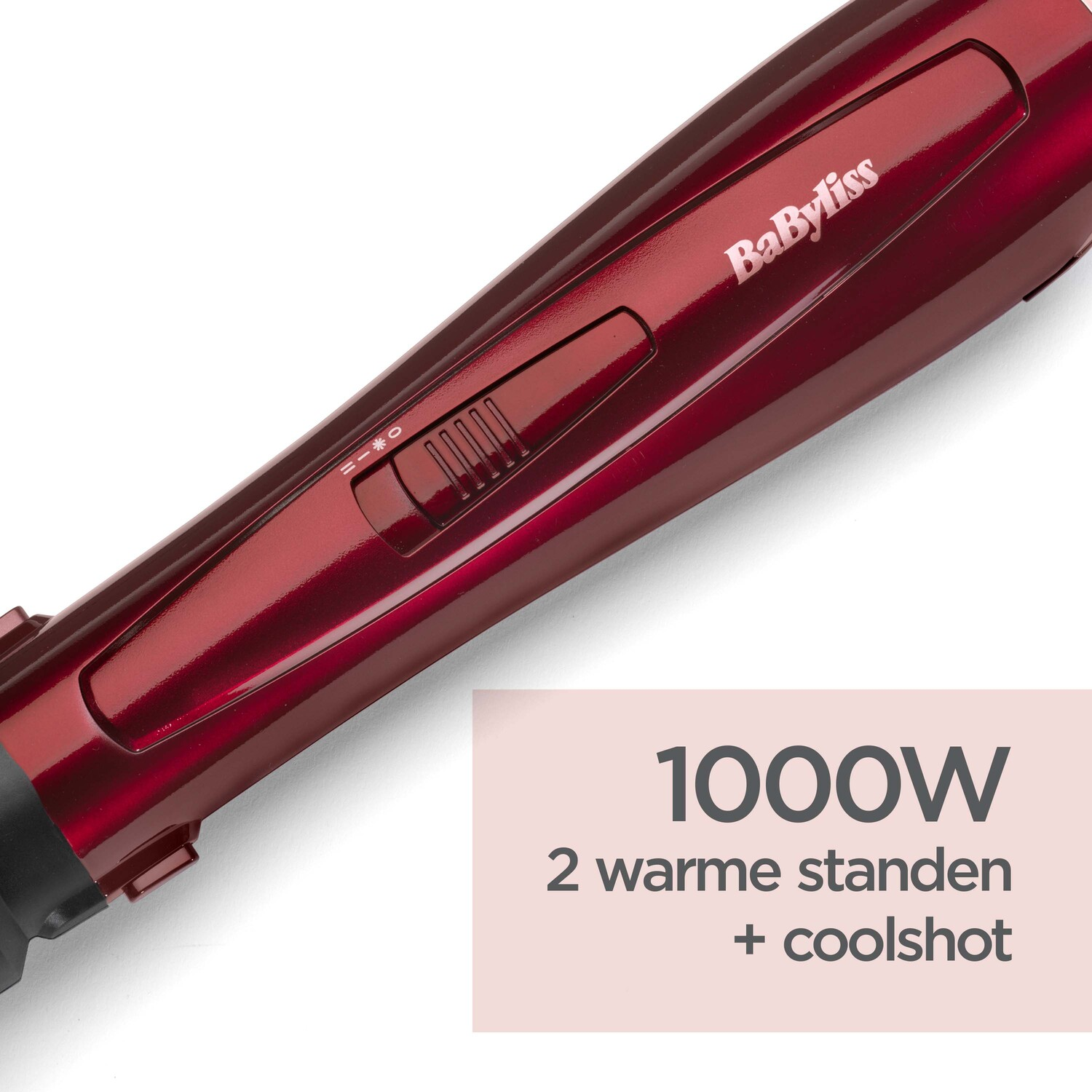 A red hair styling device with a power setting and a text that says 1000W and other details.