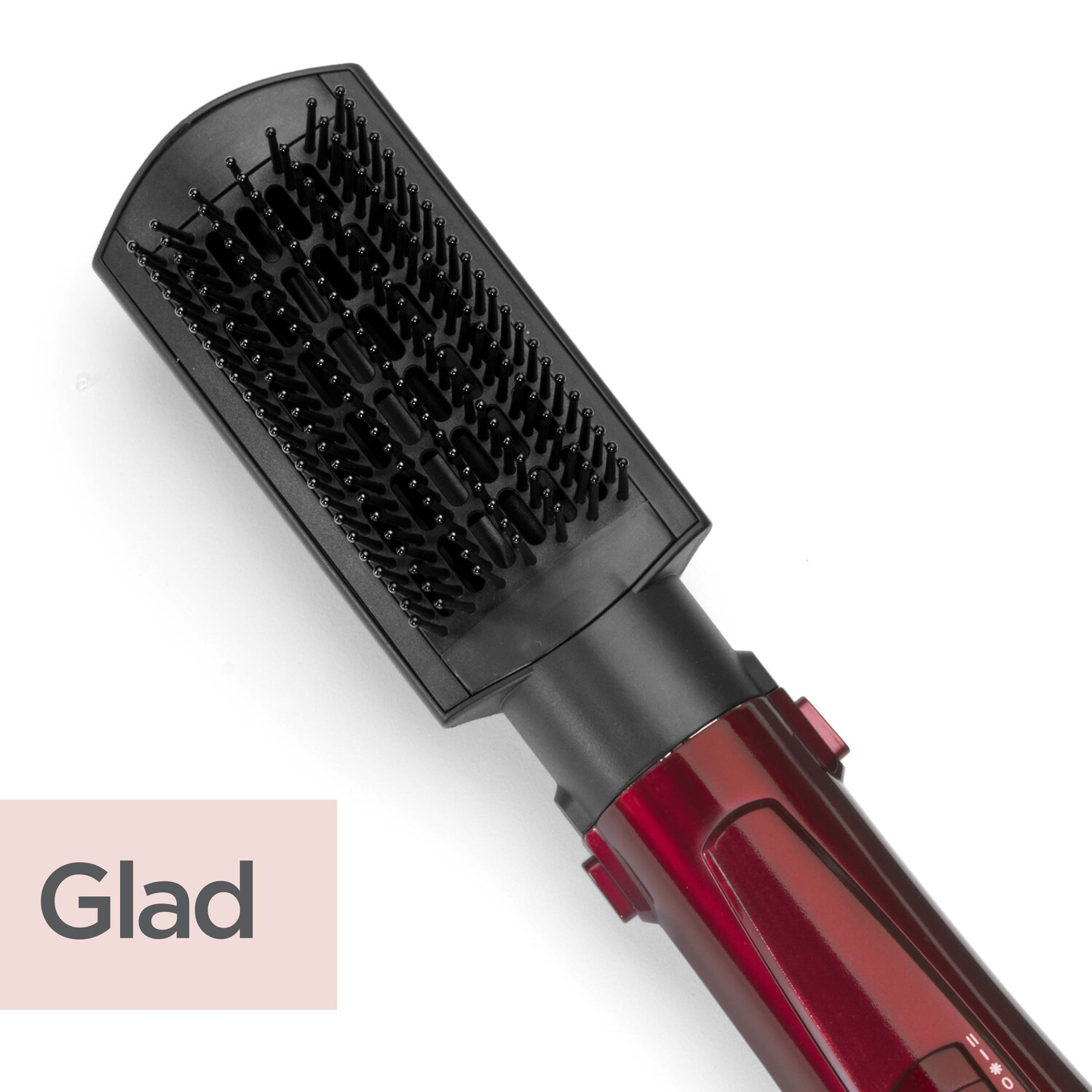 Hair dryer with black brush head and maroon handle on white.
