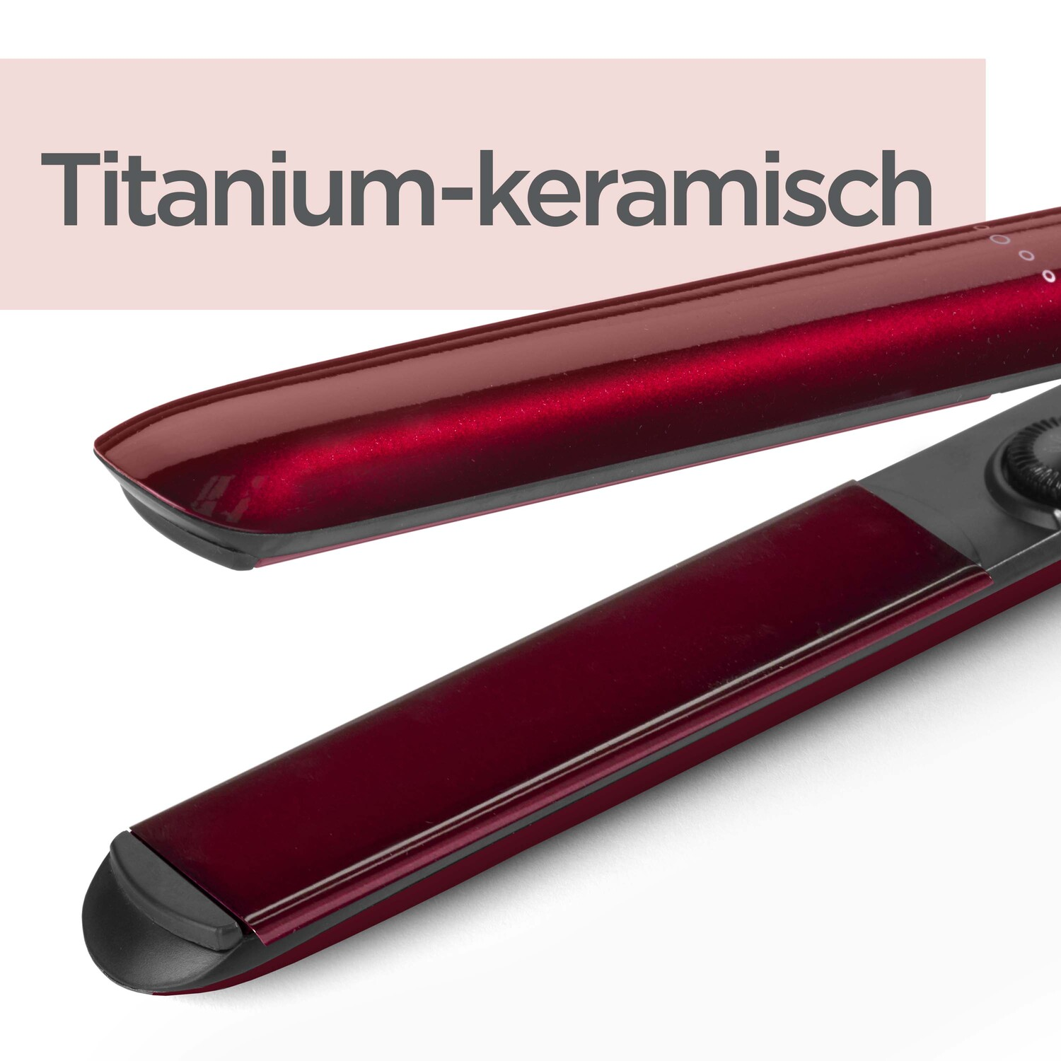 A hair straightener, close-up, red color, with black details.