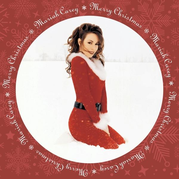 Mariah Carey album borító, piros ruha, térdel a hóban, körben szöveg.