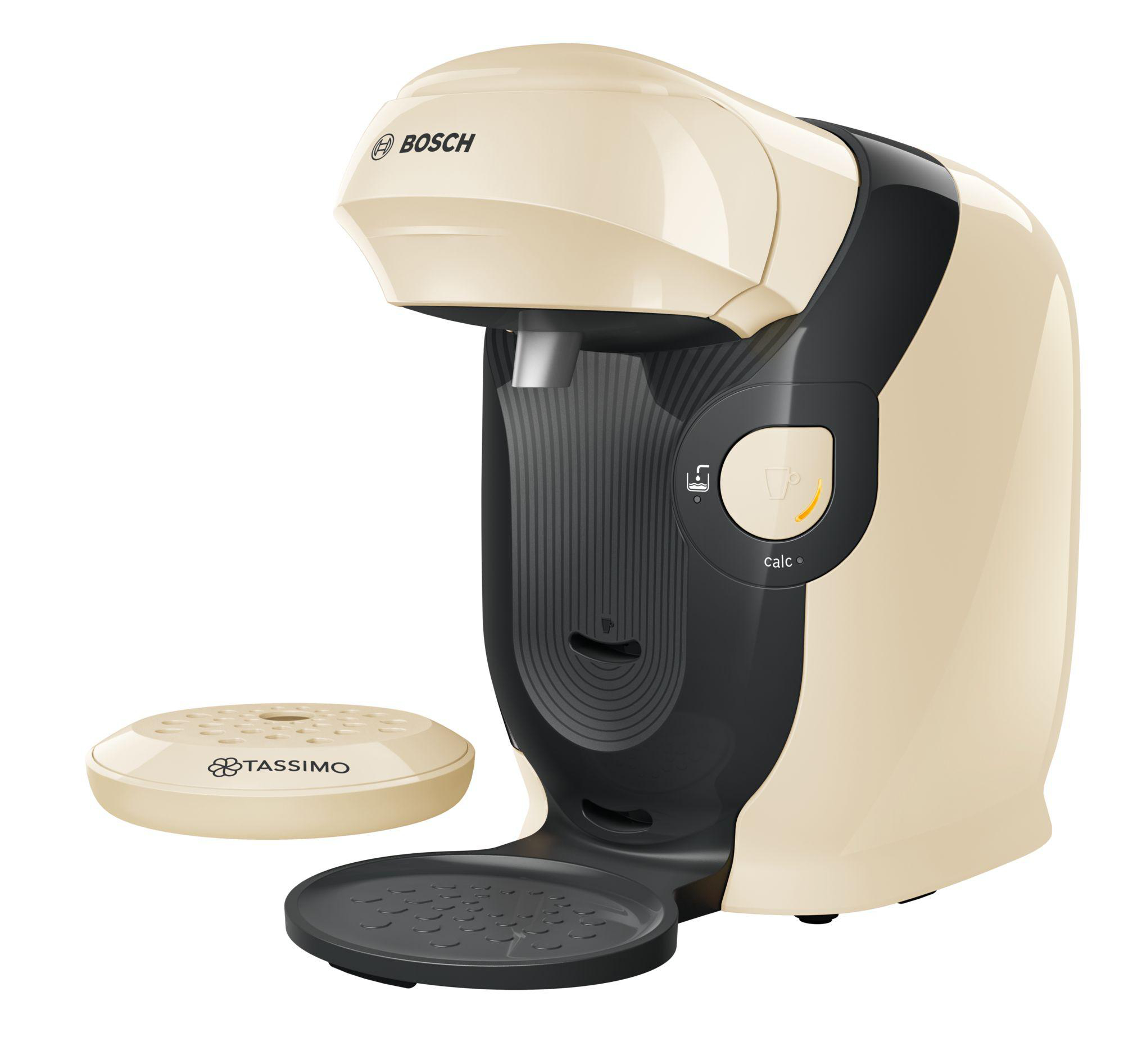 Eine cremefarbene und schwarze Tassimo-Kaffeemaschine mit separater Brühplattform.