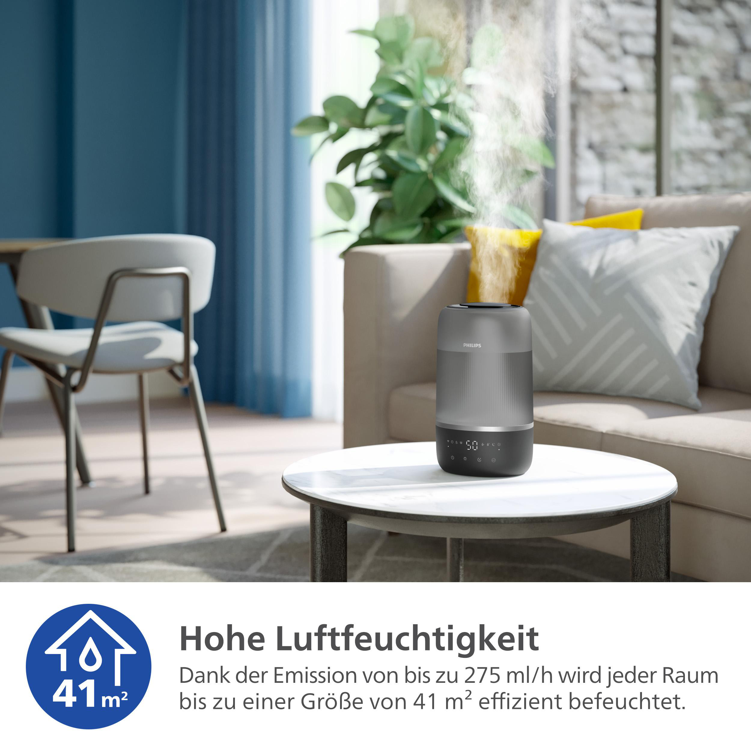 Ein Luftbefeuchter auf einem Tisch in einem Wohnzimmer.