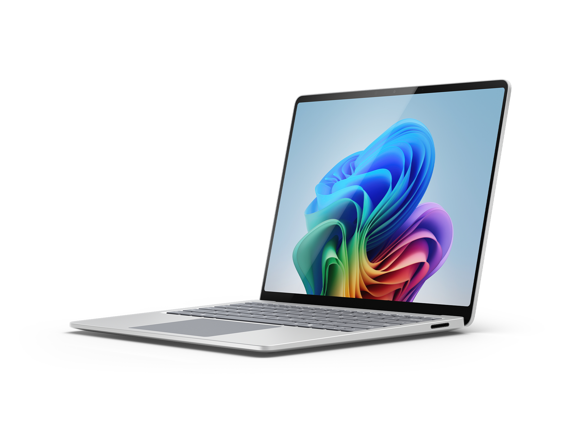 Silberner Laptop mit farbenfrohem Display auf weißer Oberfläche. Der Bildschirm zeigt eine wirbelnde Regenbogen Grafik.