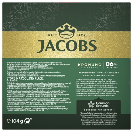 Opakowanie kawy w zielono-złotym designie. Tekst zawiera 'JACOBS' i 'KRÖNUNG' ze szczegółami.