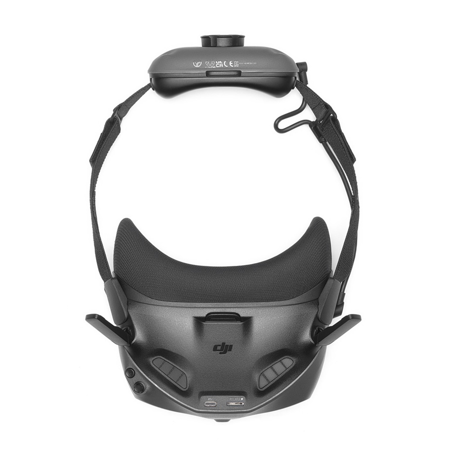 Cuffie VR su sfondo bianco. È nero con cinghie e un componente superiore.