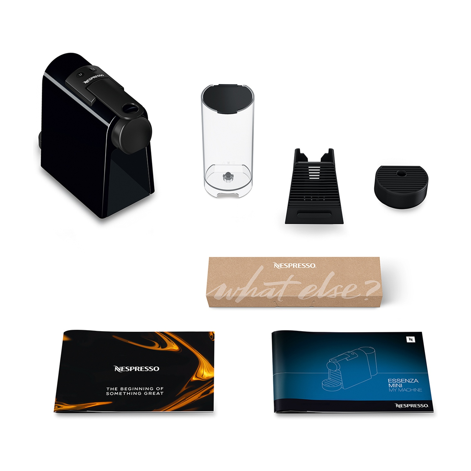 Macchina Nespresso Essenza Mini con accessori e materiali stampati.