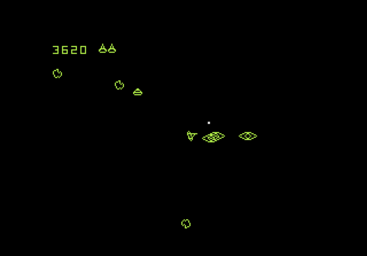 Ein Retro-Arcade-Spielbildschirm mit grünem Text und Formen auf schwarzem Hintergrund.