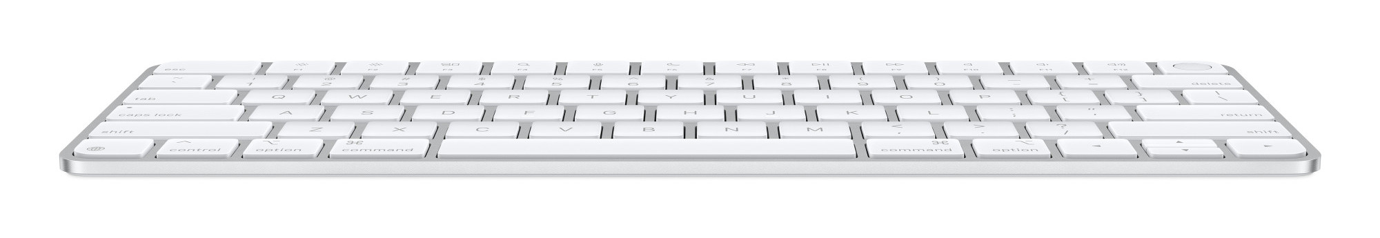 Biała klawiatura Apple na białej powierzchni, z odbiciami światła.