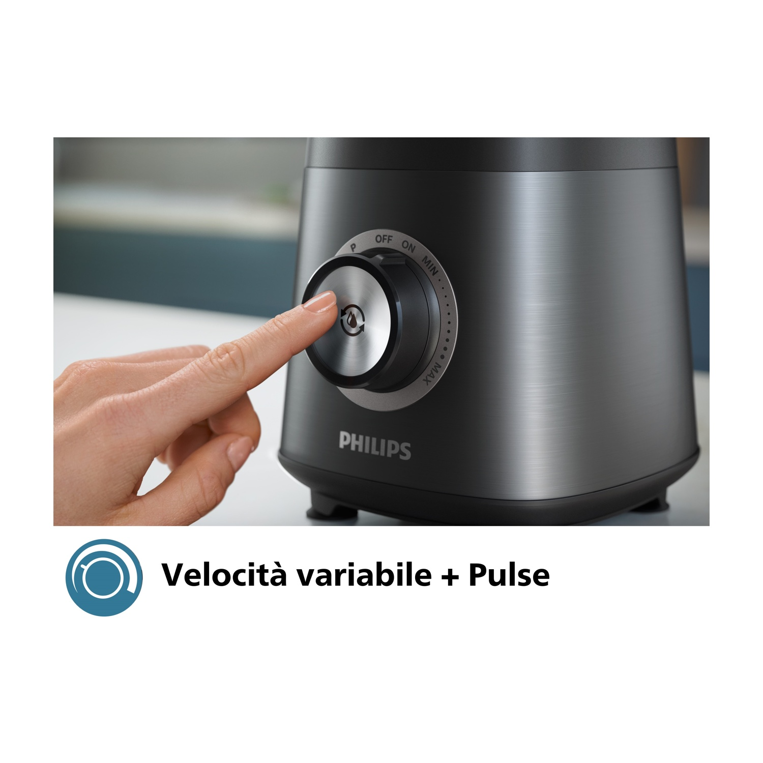 Una mano gira un selettore su un frullatore nero. La parola PHILIPS è visibile. Il selettore è argentato.