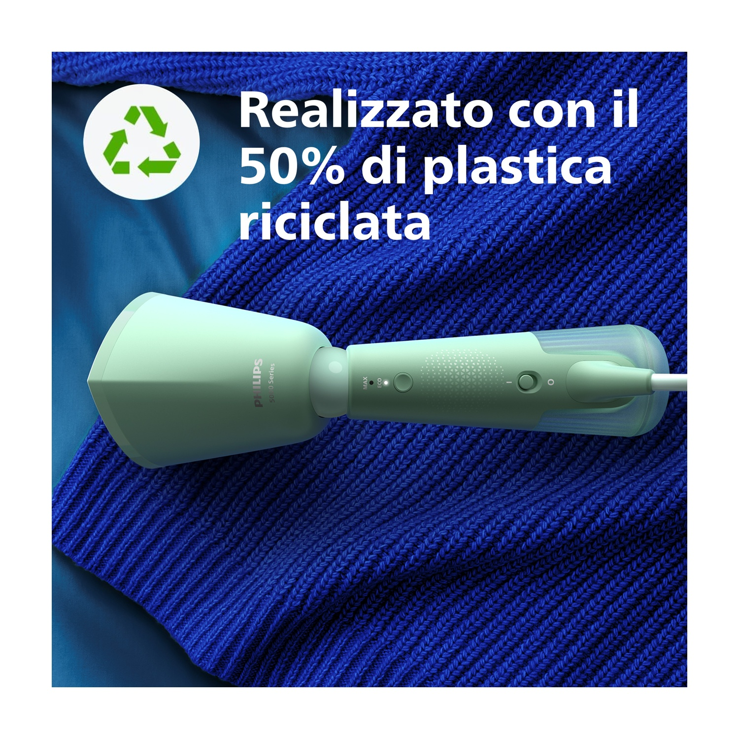 Spazzolino elettrico Philips verde e bianco su trama blu a maglia.
